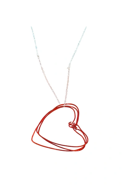 A Blonde And Her Bag Red Hearts Necklace On A Silver Chain In Pink