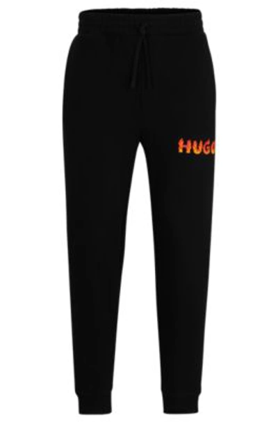 Hugo Boss Cotton-terry Tracksuit Bottoms With Puffed Flame Logo In Black