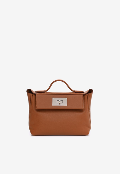 Hermes 24/24 21 In Gold Evercolor And Swift With Palladium Hardware In Brown
