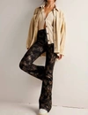 FREE PEOPLE JAYDE PRINTED METALLIC FLARE JEANS IN BLACK