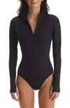 Commando Zip Long Sleeve Scuba Knit Thong Bodysuit In Black