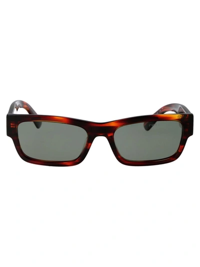 Prada Eyewear Rectangular Frame Sunglasses In 13o03r Red/black Havana