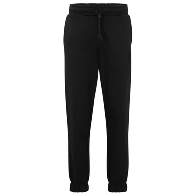 Hugo Boss Relaxed-fit Cotton-terry Tracksuit Bottoms With Stacked Logo In Black