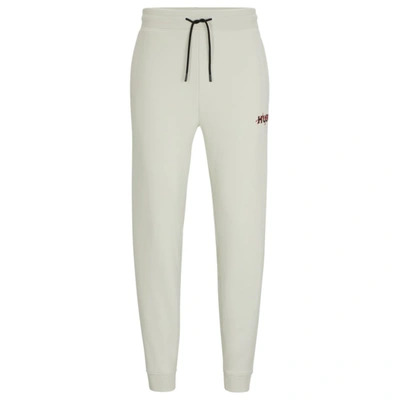 Hugo Boss Monogram-print Tracksuit Bottoms With Striped Tape In Green
