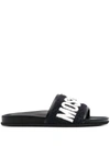 MOSCHINO TERRY LOGO LEATHER SLIDES IN BLACK