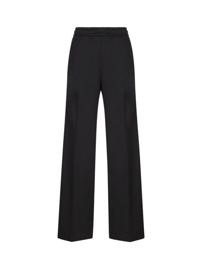 Gucci Logo Embroidered Trousers In Black