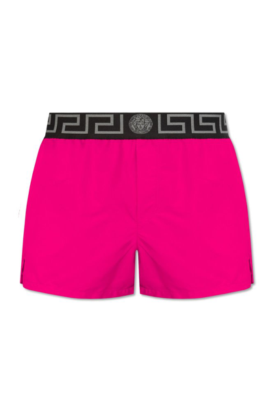 Versace Greca Logo Waistband Swim Shorts In Pink