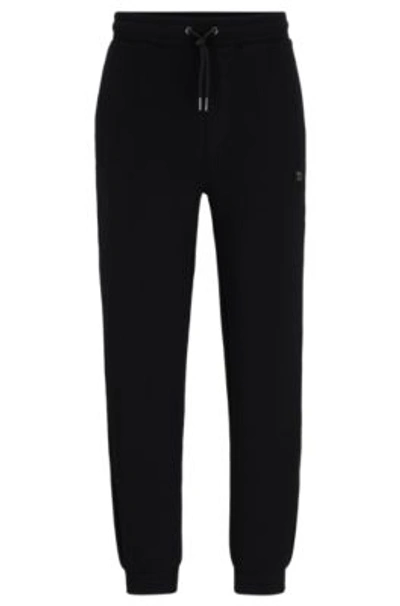 Hugo Stretch-cotton Tracksuit Bottoms With Stacked Logo In Black