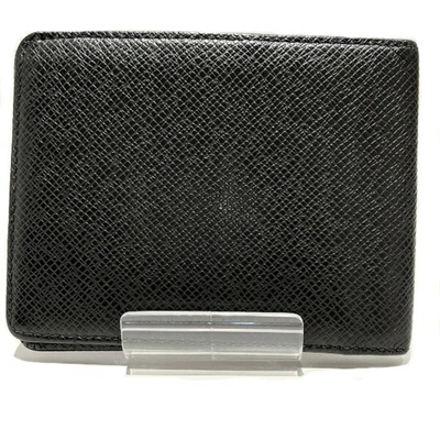 Pre-owned Louis Vuitton Taiga Leather Wallet () In Black