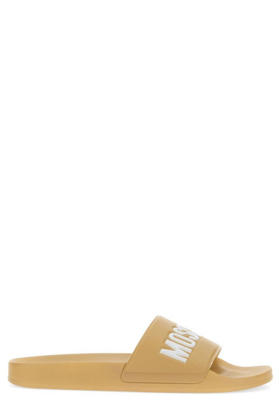 Moschino Logo Debossed Slides In Beige