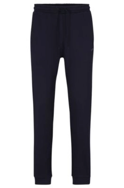 Hugo Boss Cotton Tracksuit Bottoms With Curved Logo In Dark Blue