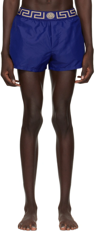 Versace Logo Embroidered Swim Shorts In Bluette Gold