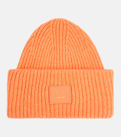 Acne Studios Pansy Ribbed-knit Wool Beanie In Orange