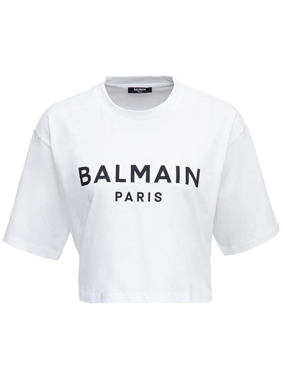 BALMAIN WHITE CROPPED T-SHIRT WITH CONTRASTING LOGO PRINT IN COTTON WOMAN