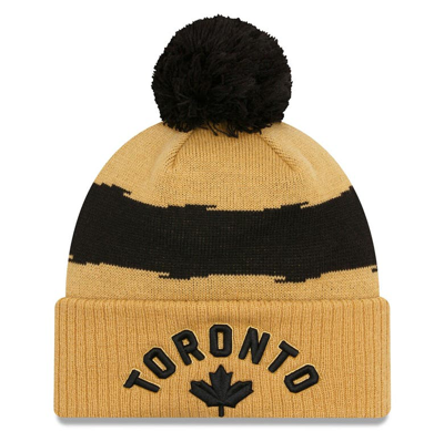 New Era Gold Toronto Raptors 2023/24 City Edition Cuffed Pom Knit Hat