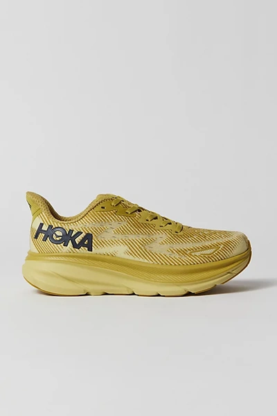 Hoka One One Clifton 9 Running Sneaker In Golden Lichen/celery Root, Women's At Urban Outfitters