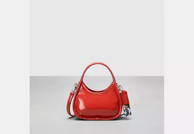 Coach Outlet Mini Ergo Bag With Crossbody Strap In Crinkled Patent Leather In Orange