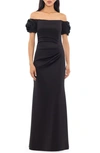 XSCAPE XSCAPE EVENINGS ROSETTE OFF THE SHOULDER SCUBA GOWN