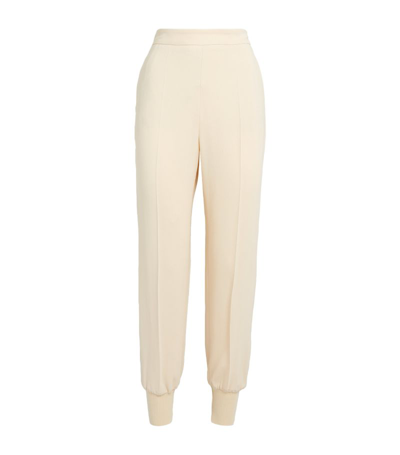 Stella Mccartney Iconic Tapered Stretch-jersey Trousers In Off White