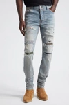 AMIRI THRASHER RIPPED CAMO PATCHES SKINNY JEANS