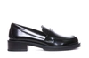 Stuart Weitzman Palmer Glossed-leather Loafers In Black