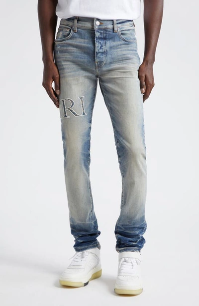 Amiri Bandana Core Logo Distressed Stretch Denim Jeans In Vintage Indigo