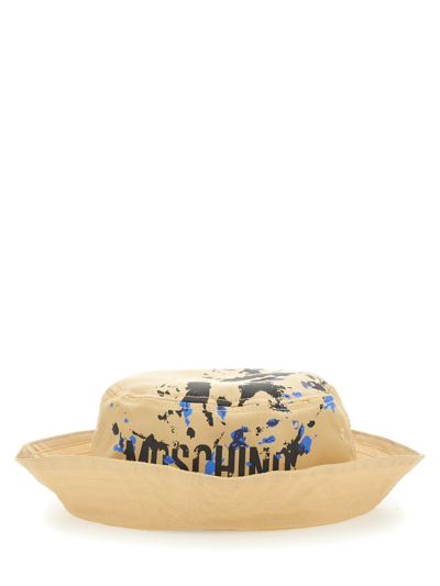 Moschino Logo Printed Flat Crown Bucket Hat In Beige