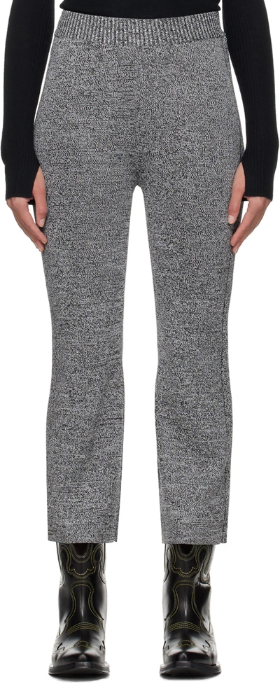Ganni Melierte Kick-flare-hose Aus Stretch-strick In Schwarz