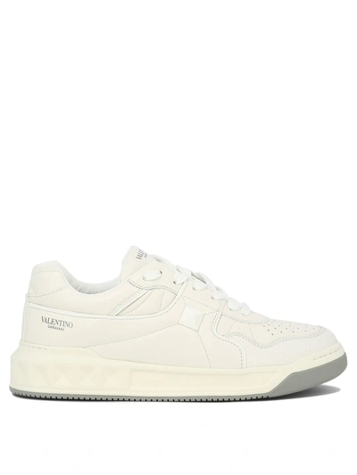 Valentino Garavani Rivet-decorated Mid-top Leather Casual Sneakers In White