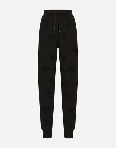 DOLCE & GABBANA JERSEY JOGGING PANTS WITH CUT-OUT AND DG LOGO