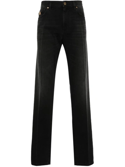 Versace Stonewashed Cotton Denim Jeans In Black