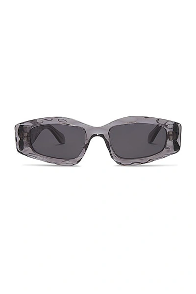 Alaïa Narrow Rectangular Sunglasses In Grey