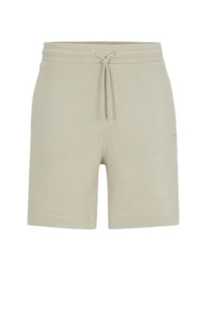 Hugo Boss Cotton-terry Regular-fit Shorts With Logo Badge In Beige
