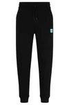 Hugo Cotton-terry Tracksuit Bottoms With Red Logo Label In Black