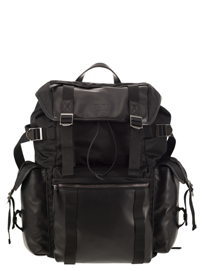 Tod's Debossed Logo Buckle Fastened Backpack In Black
