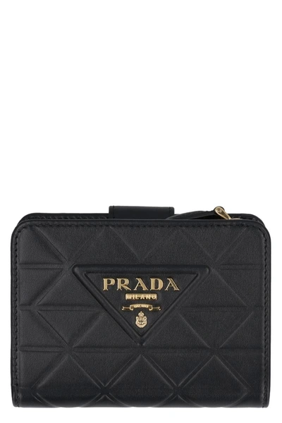 Prada Small Leather Flap-over Wallet In Black