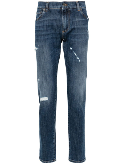 Dolce & Gabbana Ripped-detail Tapered Jeans In Blue
