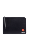 KENZO BLACK CLUTCH BAG WITH LOGO PATCH AND WRIST STRAP IN LEATHER MAN