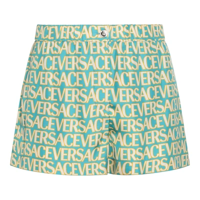 Versace All-over Logo Shorts In Blue