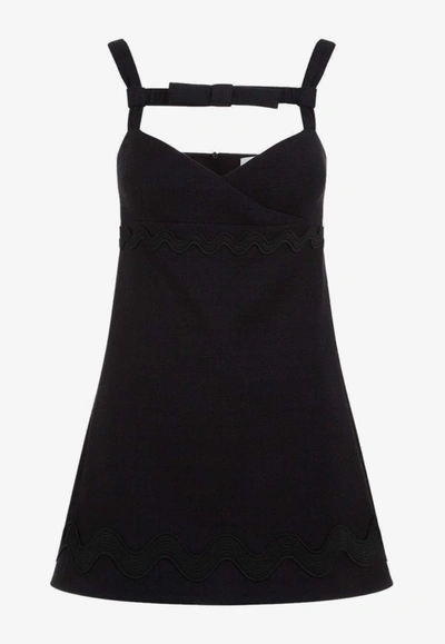 Patou Bow-embellished Sleeveless Mini Dress In Black