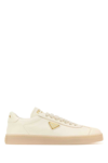 Prada Streamlined Leather Low-top Sneakers With Metallic Accent In White