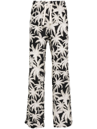 PALM ANGELS ALLOVER LOGO LOOSE FIT TROUSERS