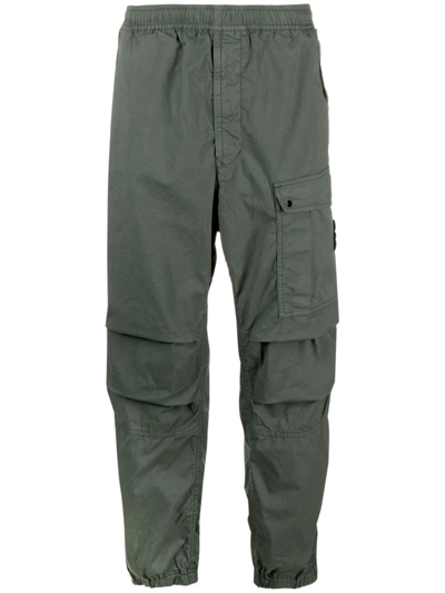 Stone Island Compass-badge Tapered-leg Trousers In Green
