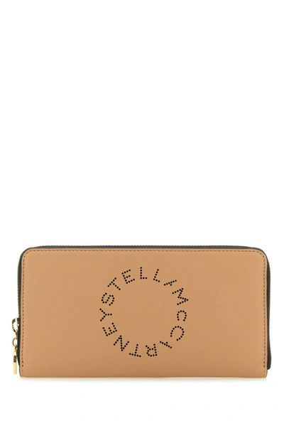 Stella Mccartney Logo Perforated Zipped Wallet In Sand