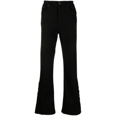 Amiri Flared-leg Cotton Jeans In Black