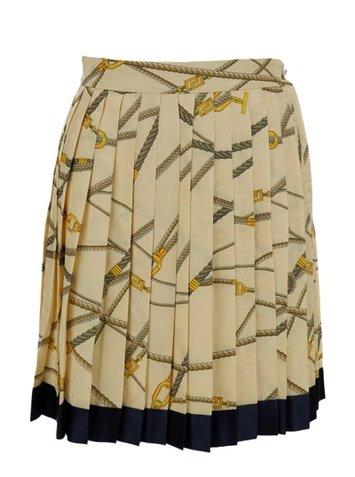 VERSACE PALE YELLOW PLEATED MINI SKIRT WITH ALL-OVER LOGO PRINT IN SILK BLEND WOMAN