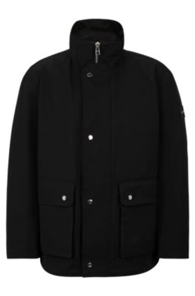 Hugo Boss Regular-fit Jacket With Monogram-patterned Packable Hood In Black