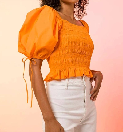 Line And Dot Short-sleeve Smocked Top In Orange