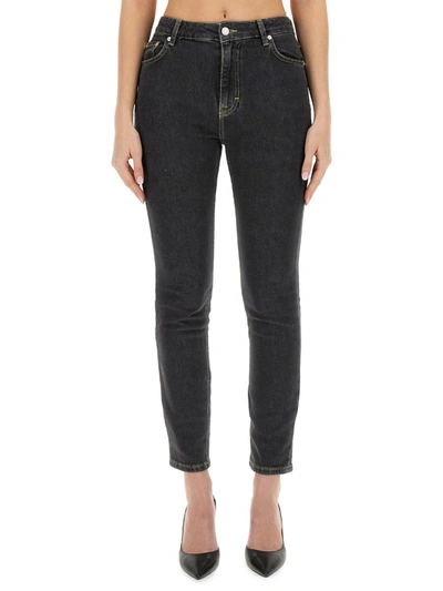 Moschino Faded Mid-rise Slim-fit Jeans In Black