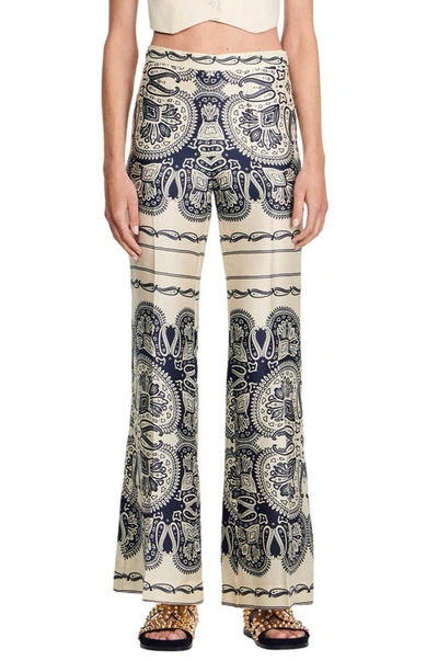 Sandro Printed Flared Trousers In Beige